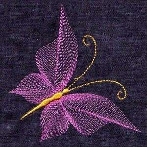 a close up of a purple flower on a black cloth with gold threadwork work