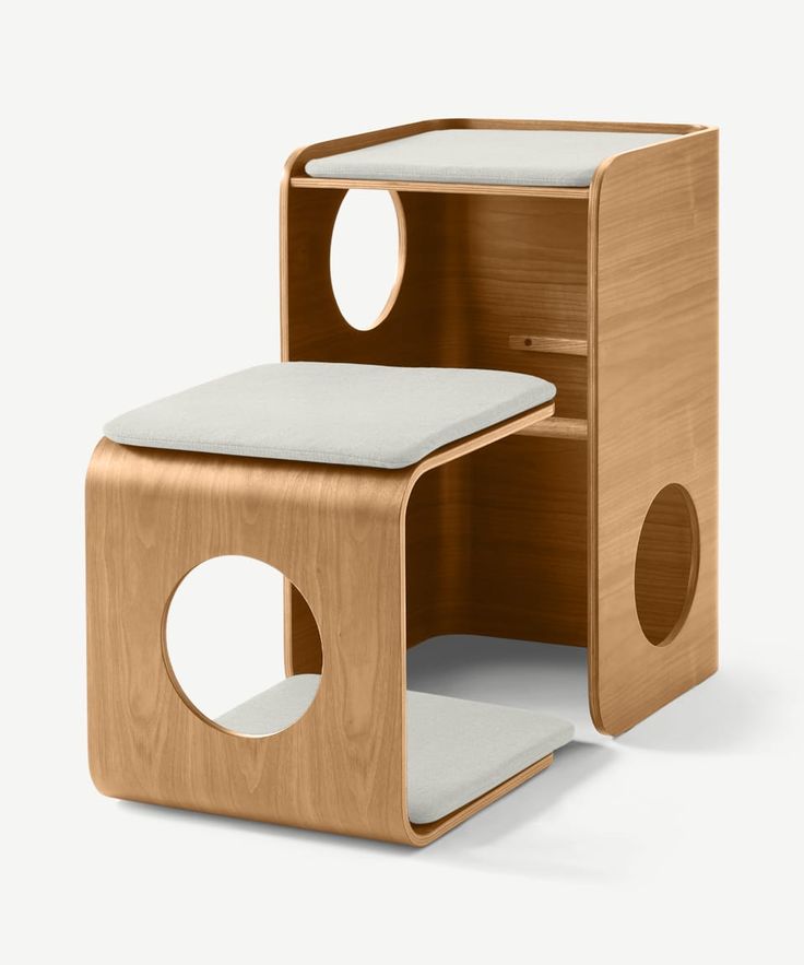 the wooden side table has two holes in it and one hole is open to show something