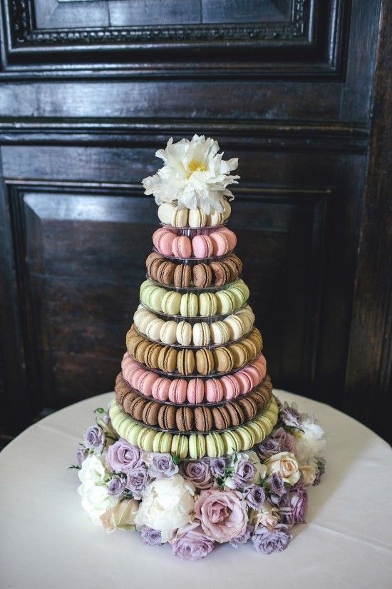 a wedding cake made out of macaroons and flowers