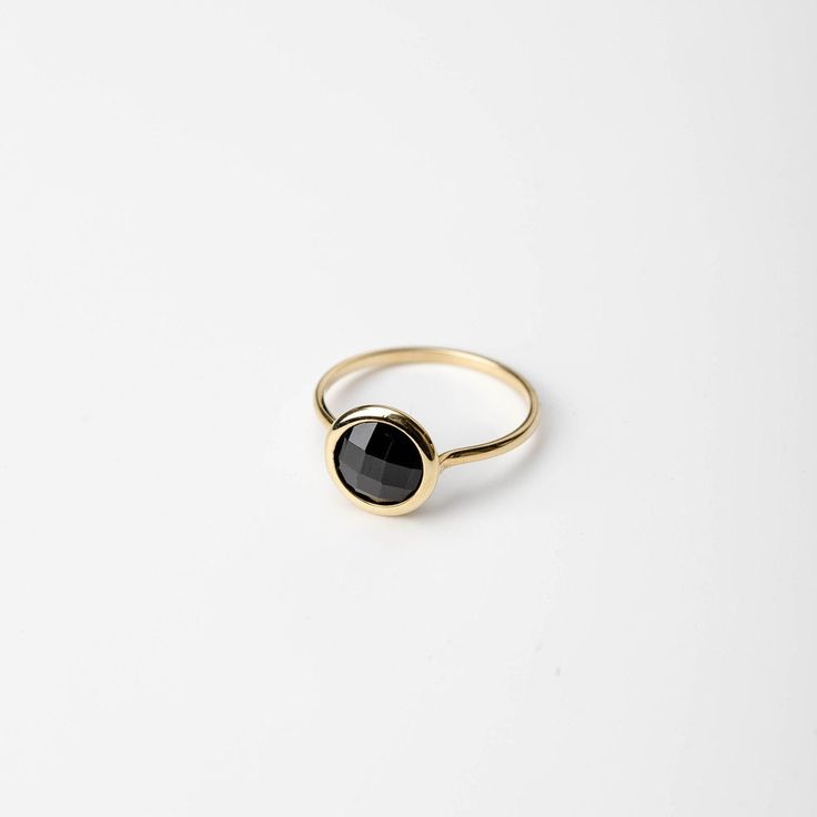 Natural black onyx 14K solid gold ring for women. A delicate black onyx gemstone ring, ideal for stacking for every woman who loves elegance. An excellent choice for an anniversary gift or a Christmas gift for her by Kyklos. 100% handcrafted with love! D E T A I L S ● Metal: 14K solid gold, 14K white gold or 14K rose gold ● Gemstone: Black Onyx, briolette cut ● Stone Diameter: 8mm (0.31in), 10mm (0.4in) and 12mm (0.5in)  R I N G ∙ S I Z I N G For General Reference: ● we use standard US Ring Sizing ● an average women's ring finger is size 6-7 ● each ring is custom made upon order, in any desired size. ● if your ring size is not listed please contact us H O W ∙ T O ∙ O R D E R Choose from the drop down menus the available options (MetalColor-StoneSize, Ring Size) and leave us a note for any Minimalist Onyx Ring For Formal Occasions, Minimalist Onyx Rings For Formal Occasions, Timeless Onyx Gemstone Rings, Elegant Onyx Signet Ring With Gemstone, Minimalist Ring With Polished Round Stone, Fine Jewelry Black Stackable Jewelry, Minimalist Rings With Polished Round Stone, Elegant Yellow Gold Rings With Black Spinel, Elegant Yellow Gold Ring With Black Spinel