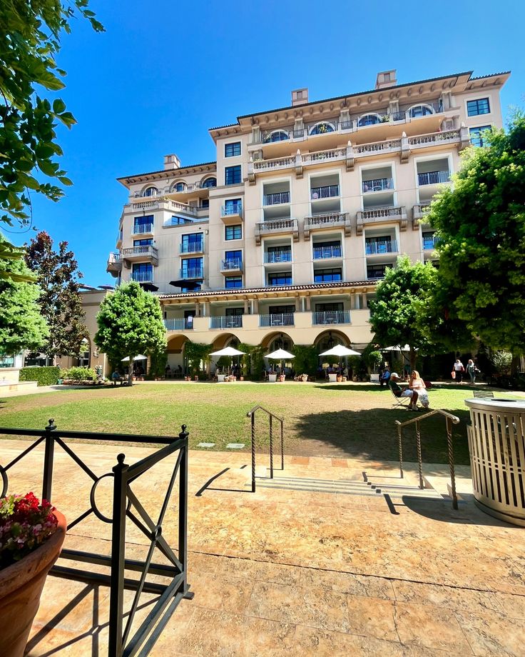 a large building with many balconies in front of it