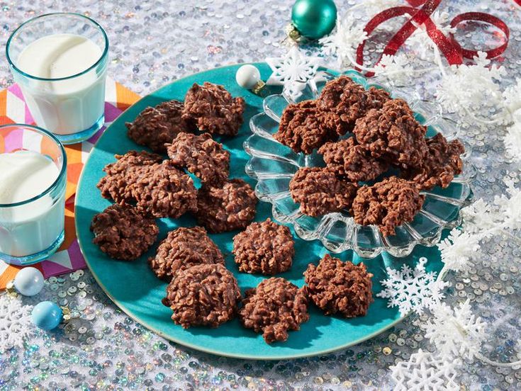 chocolate cookies and milk on a blue plate