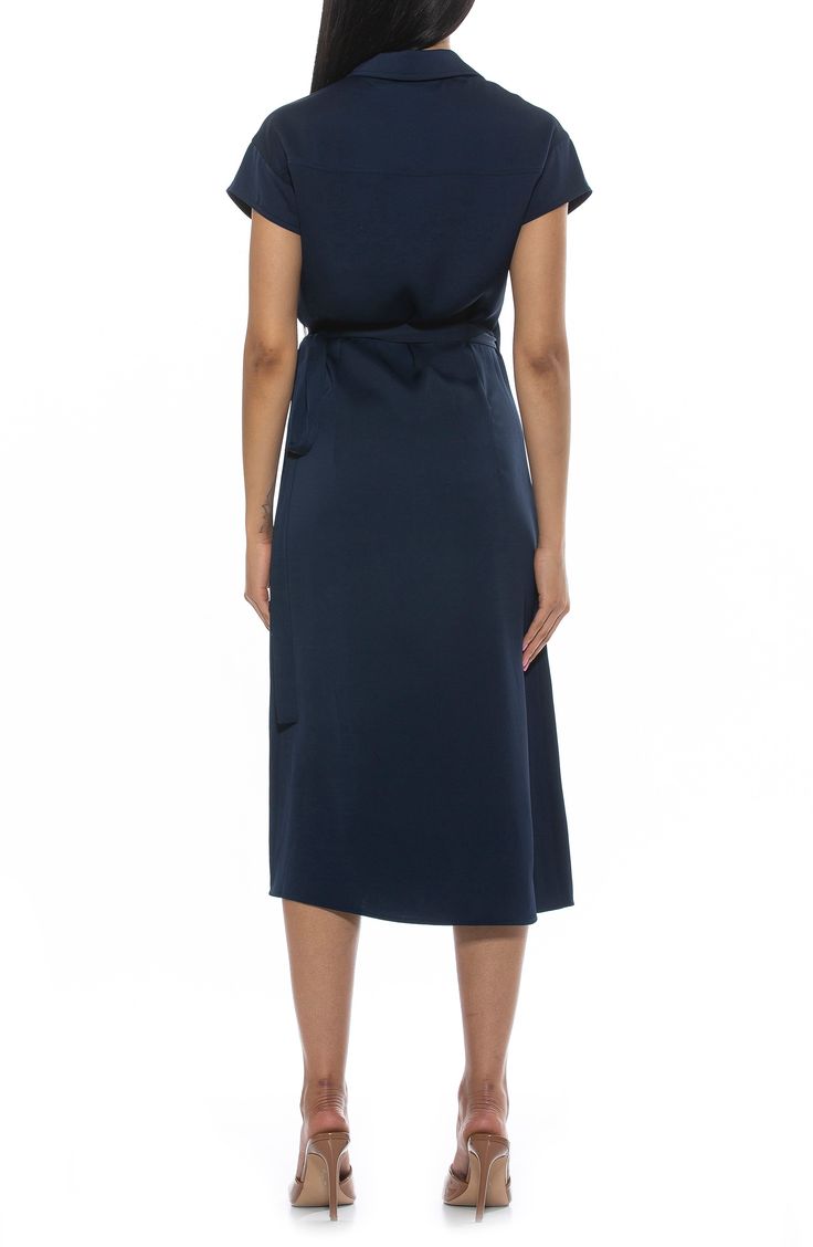 Show off sophisticated style in a surplice wrap midi dress fashioned with a neatly spread collar and O-ring tie closure. Spread collar Cap sleeves True wrap style with side tie closure 100% polyester Machine wash, line dry Imported Model stats: 5'10" height, 32" bust, 25" waist, 36" hip. Model is wearing size 2. Formal Summer V-neck Belted Dress, Chic V-neck Midi Dress With Tie Fastening, Formal Knee-length Faux Wrap Dress, Chic A-line Wrap Dress For Formal Occasions, Elegant A-line Wrap Dress For Date Night, Fitted V-neck Belted Dress For Daywear, Elegant V-neck Midi Dress For Daywear, Formal V-neck Belted Dress With Tie Waist, Chic Wrap Dress With Surplice Neckline