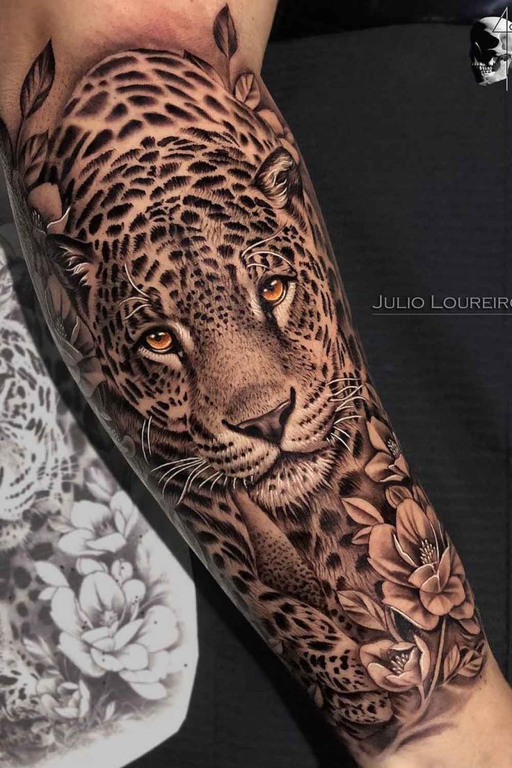 an arm with a leopard and flowers on it