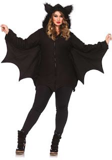 a woman wearing a black bat costume