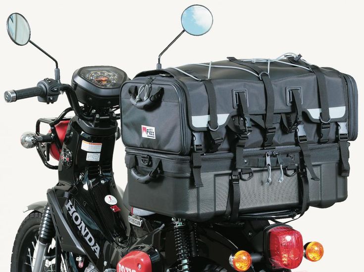 a motorcycle with several bags on the back