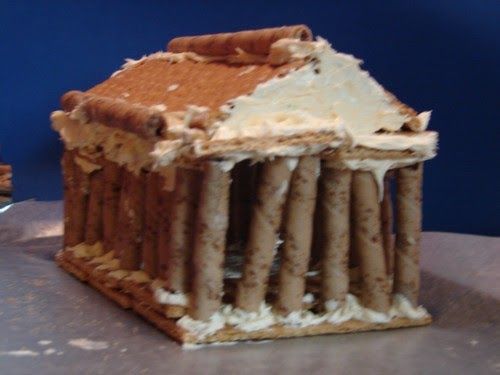 a cake made to look like an ancient greek temple