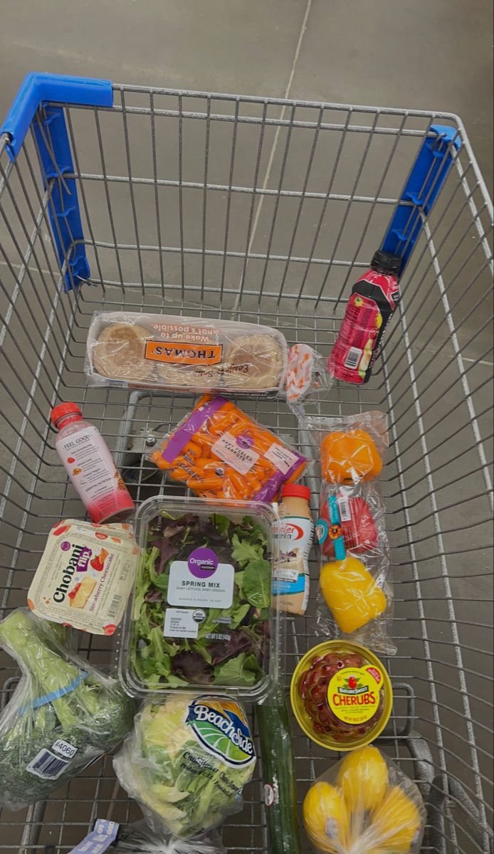 a shopping cart filled with lots of food