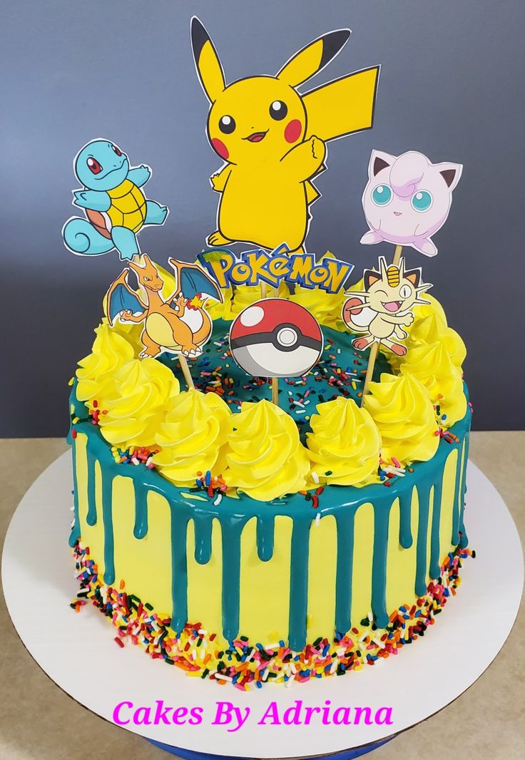 a pokemon themed cake with yellow frosting and sprinkles on the top