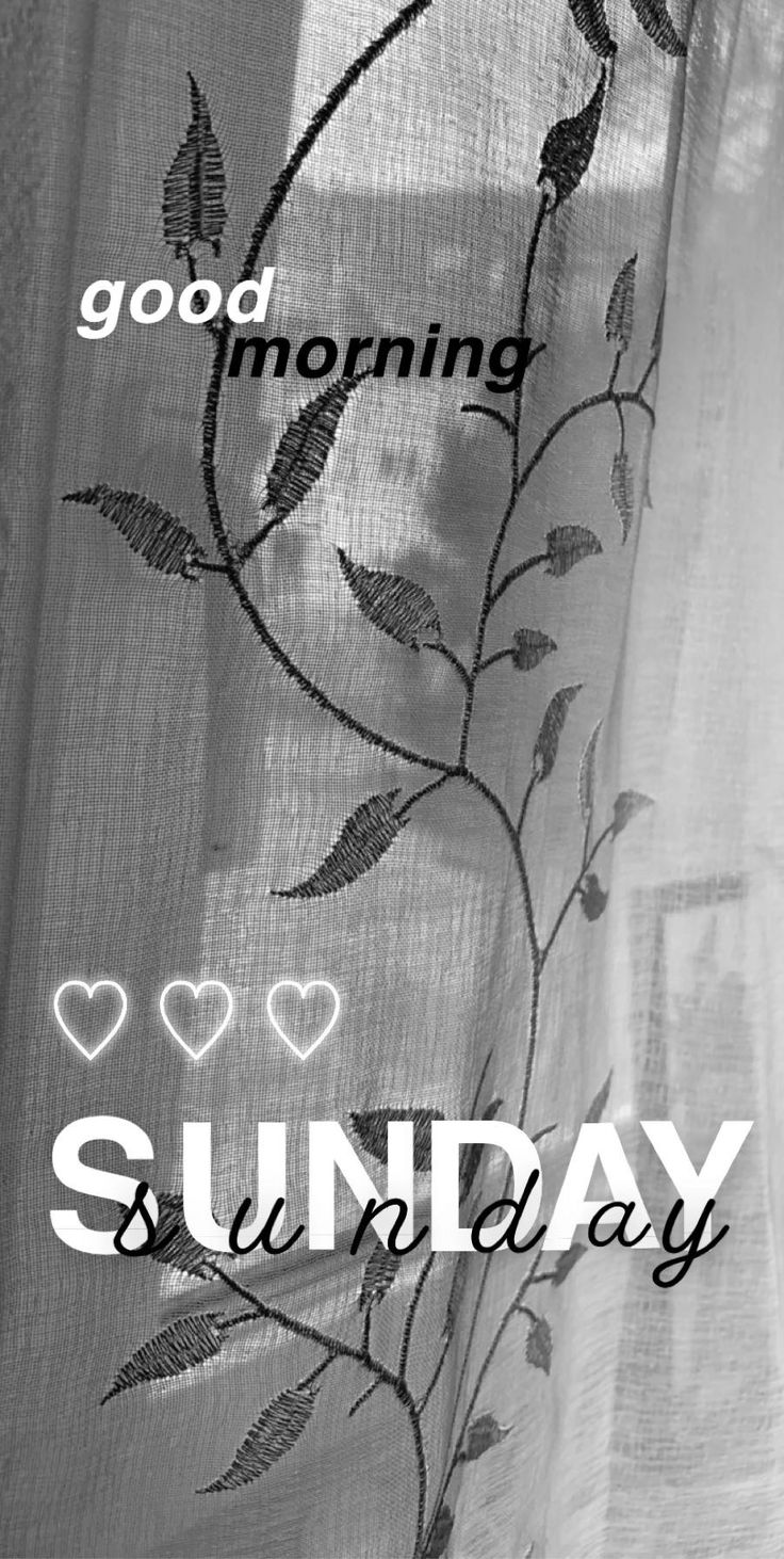 the words good morning sunday are written in white and black on a sheered curtain