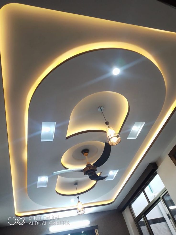 the ceiling is decorated with modern lighting fixtures