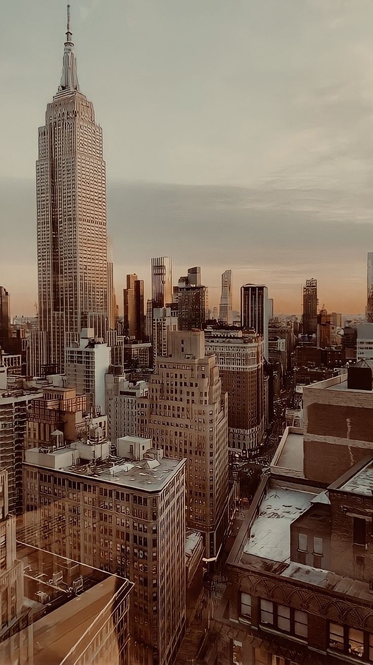 an aerial view of the city with skyscrapers and other tall buildings in the background