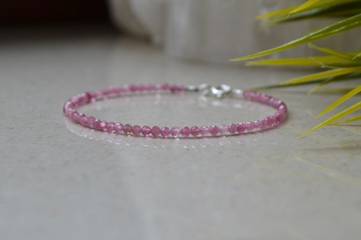 "Natural Pink Tourmaline Bracelet is perfect for Heart Chakra Bracelet. A gorgeous bracelet of precious pink tourmaline finished with a Sterling Silver clasp. Wear this bracelet on its own or stack it with your other favorite bracelets to create your own story. This bracelet is dainty, delicate and sparkly. . ❗️Sign up to our Newsletter and get 15% OFF your order (copy this link to browser search) - https://forms.gle/R74xLdL1MSmC9Apn6 ❗️ . MEASUREMENTS: Gemstones: Pink Tourmaline Beads size: 2mm Dainty Pink Bracelets With Gemstone Beads, Dainty Pink Gemstone Bead Bracelets, Dainty Pink Gemstone Beads Bracelet, Pink Gemstone Bracelets For Gift, Elegant Pink Tourmaline Bracelets, Dainty Pink Round Bracelet, Dainty Pink Beaded Bracelets With Gemstone Beads, Delicate Pink Round Bracelets, Elegant Pink Faceted Crystal Bracelet