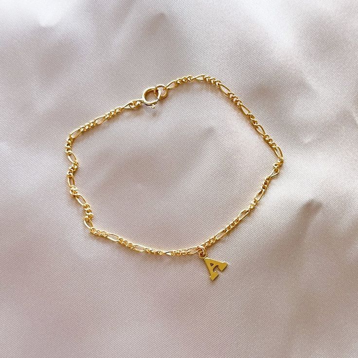 Dainty Initial Bracelet - Minimalist Letter Bracelet - 14k Gold Filled Initial Bracelet - Bridesmaid gift ideas - Birthday Gift Ideas  Hypoallergenic - Handcrafted - Waterproof - Sustainably Made.  Choose your letter! Dainty 14k gold filled letter charm on 14k gold filled Figaro Chain with spring ring clasp.  These make such a cute gift! Choose your size. Letter Bracelets Gold, Cheap Gold Letter-shaped Bracelets, Classic Initials Bracelet, Perfect As Gift, Delicate Gold Bracelet As Gift, Elegant Adjustable Gold Bracelet For Birthday Gift, Elegant Adjustable Gold Bracelet For Birthday, Dainty Charm Bracelet With Delicate Chain As Gift, Handmade Gold Bracelets As Birthday Gift, Minimalist Yellow Gold Bracelets For Mother's Day