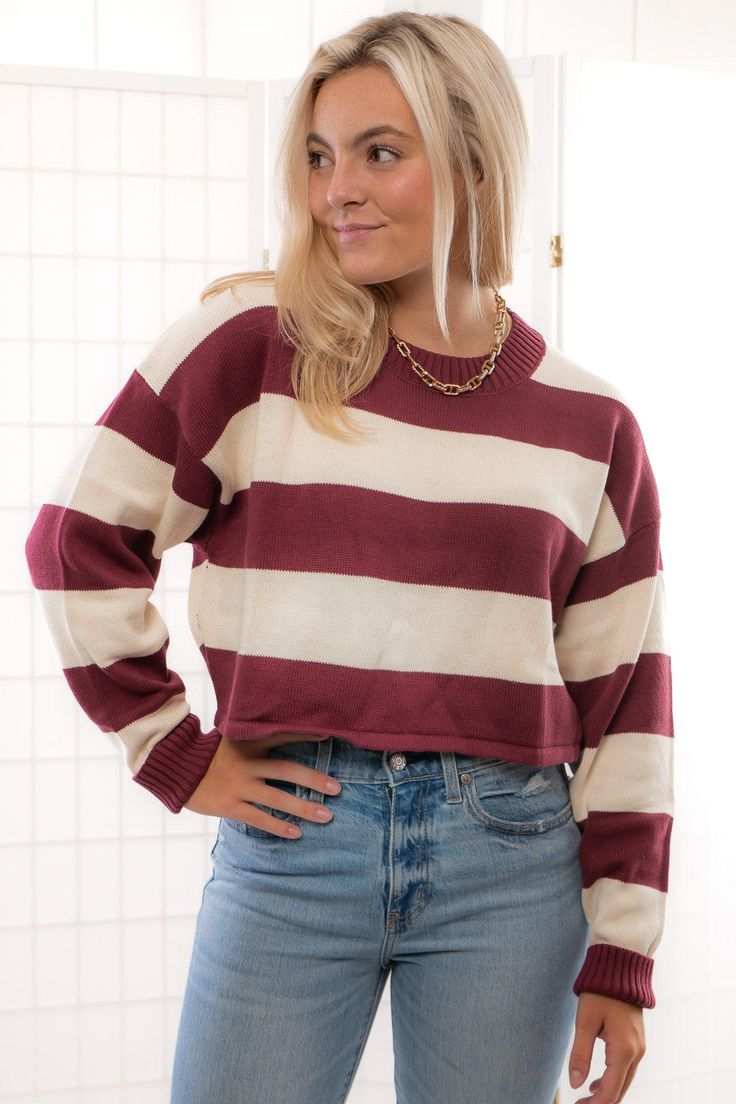 Unleash your fashion-forward vibes with the Garnet Long Sleeve Striped Crop Sweater ! This adorable cream and garnet striped sweater boasts long sleeves and a cropped design, making it both cute and comfy for effortless styling. Whether you're dressing it up for a night out or keeping it casual for a cozy day in, this versatile piece is a go-to staple for adding a playful touch to your wardrobe.   Features:   Eye-catching cream and garnet striped pattern for a chic look.  Long sleeves for a cozy Jumper Denim, Cozy Day, Baseball Outfit, Comfy Sweater, Graphic Tee Dress, Crop Sweater, Comfy Sweaters, Maxi Dresses Casual, Midi Maxi Dress