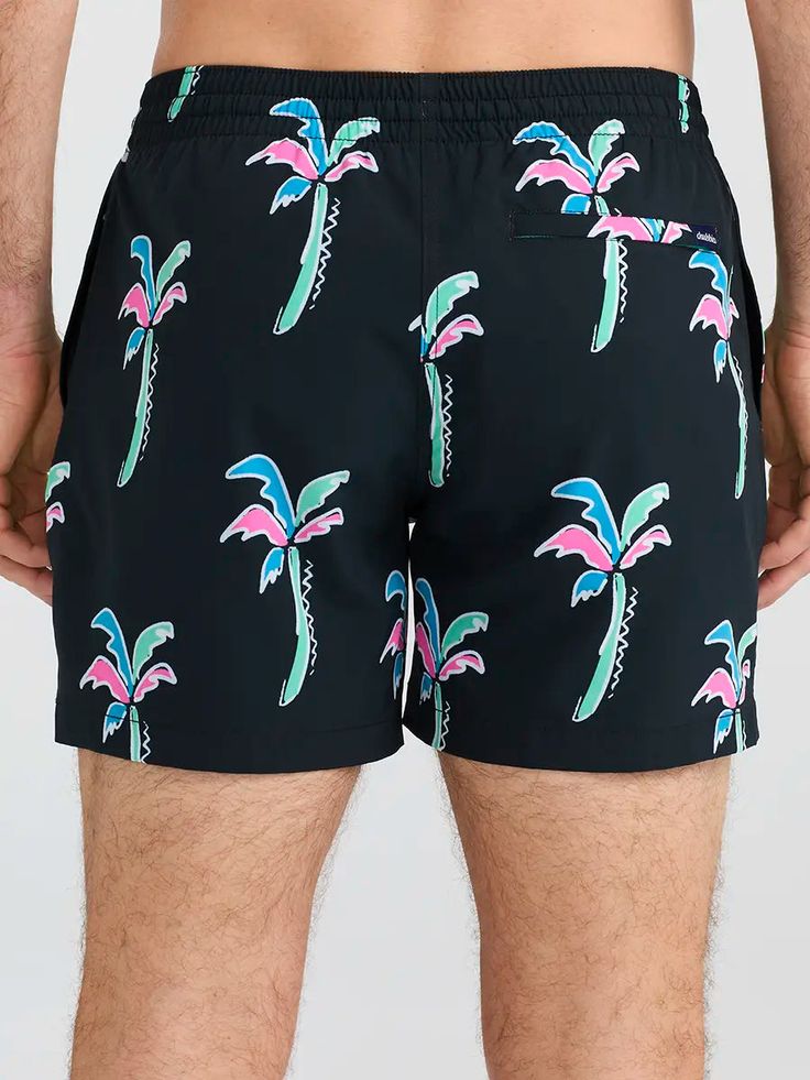 Grab your sunglasses and your flamingo floaty and sink into island time with these classic swimmers. These jealousy-inducing trunks feature an ultra quick drying shell, mesh basket liner and a zipper back pocket. Not to mention the elastic waistband and build-in drawstring designed to keep your trunks secure from the swim up bar all the way to the all you can eat crab leg buffet. Fabric: 92% Polyester/8% Spandex Machine Wash Cold, Tumble Dry Low Best for: Swimming, Sunbathing, Boat Days, Boogie Casual Swimwear With Uv Protection For Pool, Uv Protection Summer Swim Trunks For Vacation, Casual Swim Trunks With Uv Protection For Beach Season, Summer Vacation Swim Trunks With Uv Protection, Casual Palm Tree Print Swimwear For Poolside, Casual Black Swimwear For Pool, Casual Swimwear With Uv Protection For Vacation, Casual Black Swim Trunks For Beach Season, Casual Lightweight Swimwear For Poolside