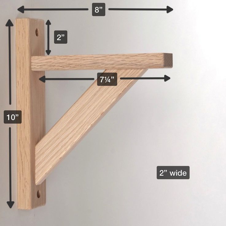 a wooden shelf with measurements for the top and bottom