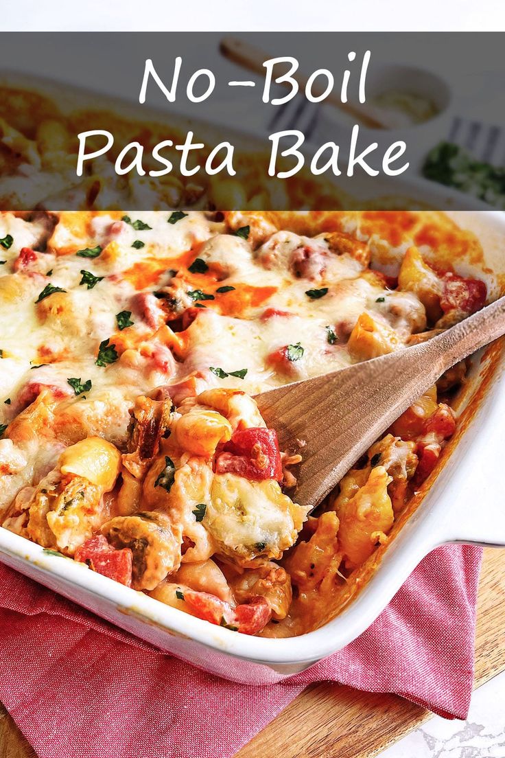 no - boil pasta bake in a casserole dish with a wooden spoon