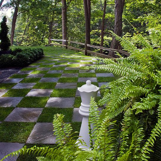 a chess board in the middle of a garden