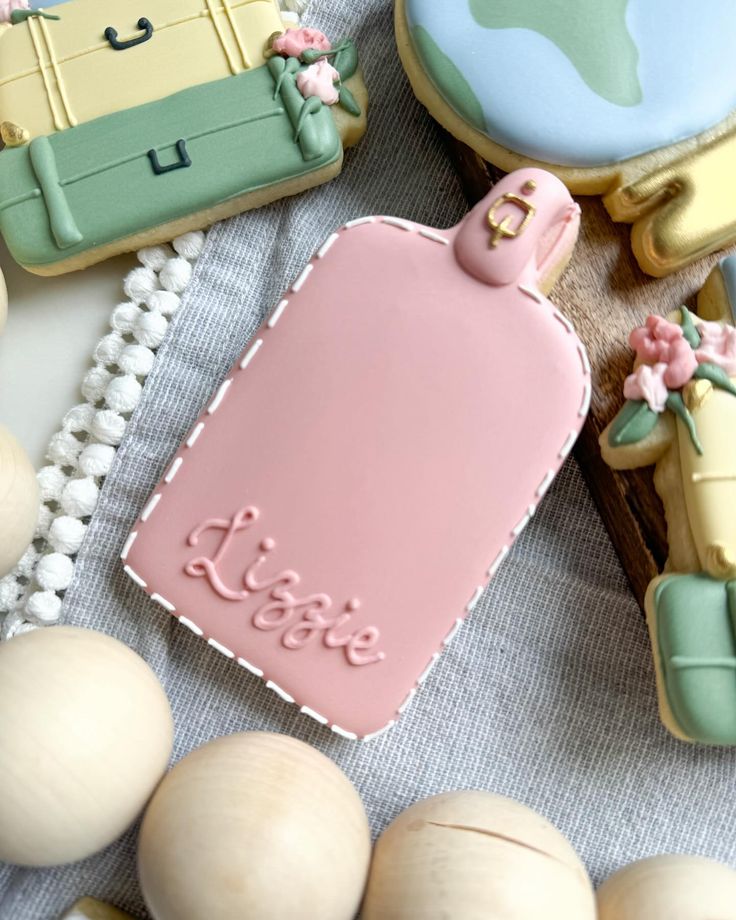 decorated cookies are sitting on a table next to some eggs and other items that have been placed around them