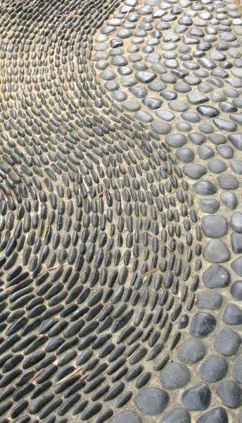 an image of a stone walkway that looks like it is made out of pebbles