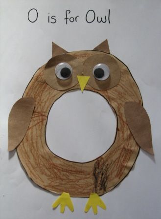 an owl made out of paper on top of a piece of paper with the words o is for owl