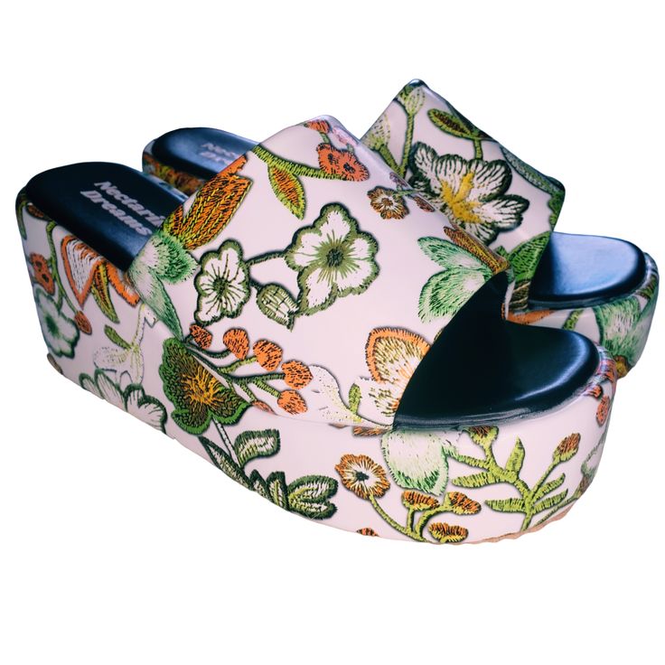 Turn heads at every summer event in the Flower Power Platform Sandals, the flatform version of our best-selling boots. Whether you're hitting a music festival or enjoying a casual day out, these sandals will make you feel unstoppable. Retro Floral Print: Captivating floral design that brings a touch of 70's nostalgia. Open-Toe Design: Perfect for showing off your summer pedicure and staying cool. Flatform Style: Provides height and stability without compromising comfort. Padded Footbed: Ensures Casual Floral Print Wedge Sandals, Summer Sandals With Chunky Platform And Flat Heel, Trendy Slip-on Platform Slippers For Summer, Summer Open Toe Platform Slippers, Open Toe Platform Slippers For Summer, Casual Floral Print Wedge Heel Sandals, Pink Platform Slippers For Beach In Spring, Pink Platform Slippers For Spring Beach Outing, Spring Pink Platform Slippers For Beach