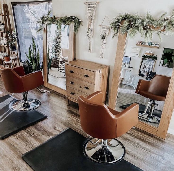 a hair salon with chairs and mirrors on the floor