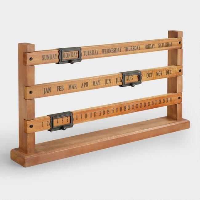 an old wooden ruler with numbers on it