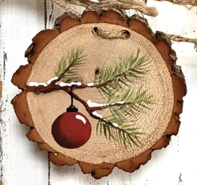 a piece of wood with a christmas ornament on it