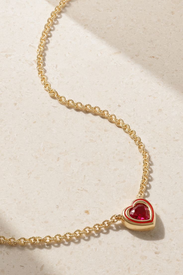 Alison Lou's necklace is part of the 'Madison' collection, which includes delicate pieces featuring a range of colorful stones in varying cuts - it's also the street name of the label's boutique. It's handmade from 14-karat gold and strung with a faceted heart-shaped ruby framed by tonal glossy enamel. Fine Gemstone Jewelry For Valentine's Day, Fine Jewelry Gemstone For Valentine's Day, Valentine's Day Gemstone Fine Jewelry, Valentine's Day Fine Jewelry With Gemstones, Red Fine Jewelry As A Gift For Her, Fine Jewelry Ruby Necklace For Valentine's Day, Luxury Pendant Jewelry For Valentine's Day, Ruby Heart Cut Gemstone Necklace, Heart-shaped Ruby Gemstone Necklace