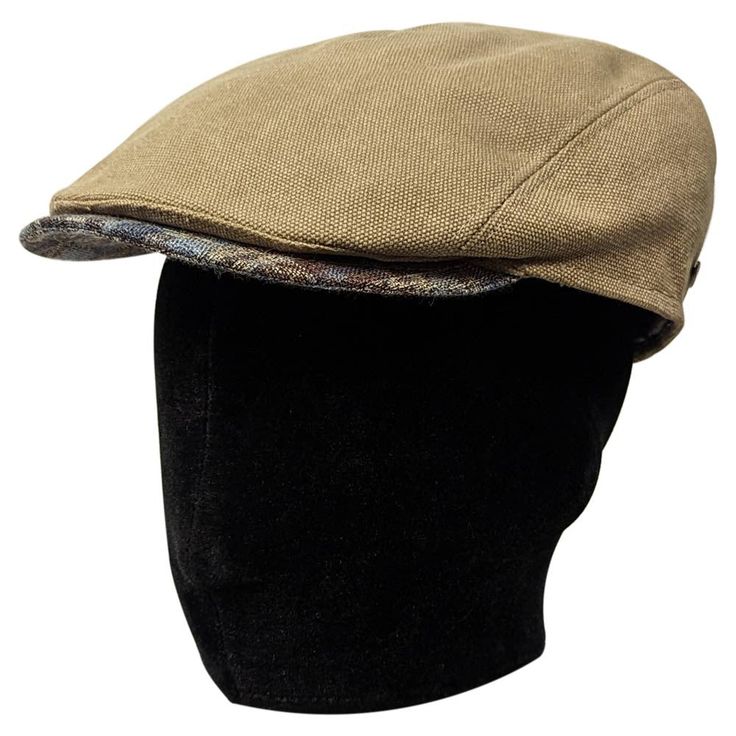 Saint Martin – "Frozen" Water Repellent Canvas Flat Cap Don't trade style for comfort in the cold and rain. Both fashionable and functional, this Saint Martin flat cap is made of water repellent cotton canvas to protect your head no matter the weather. The cap's warm olive-tinted khaki outer is complimented by a blue plaid bill. Its interior is lined with soft, breathable cotton and a paisley-patterned cotton sweatband to ensure maximum comfort. The burnished gold Saint Martin logo plays off of the cap's warm hues and rugged material to add an air of luxury to this practical and wearable cap. Made in Italy from the highest quality materials, the "Frozen"cap is as well constructed as they come. Water will bead right off this hat to keep its wearer comfortable and dry. Perfect for any weathe