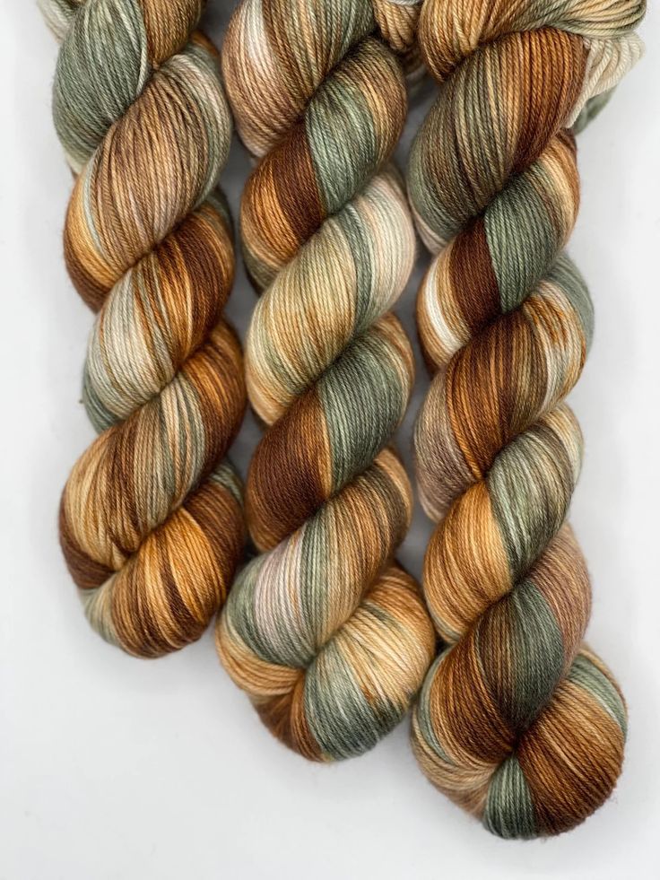 three skeins of yarn with different colors