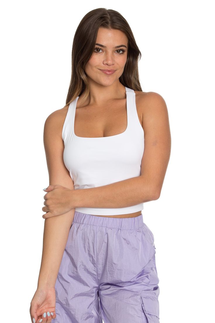 Our Whiteout Criss Cross Back Yoga Tank is our newest athletic tank and it is so flattering! It has a U-shaped front that offers coverage and a cute criss-cross style back. It features our ultra smooth, sweat-wicking material that you can wear when active or just out for the day! It is complete with built-in padding that can be removed if needed. 75% Nylon, 25% Spandex﻿ Built in / Removable Padding Model Details: Modeled in size: Small, Medium Model Waist: 25, 25 Model Bust: 32, 34 Model Height: Back Yoga, Flare Yoga Pants, Tennis Skirts, Yoga Tank, Athletic Top, Yoga Tops, Model Height, Bra Tops, Criss Cross