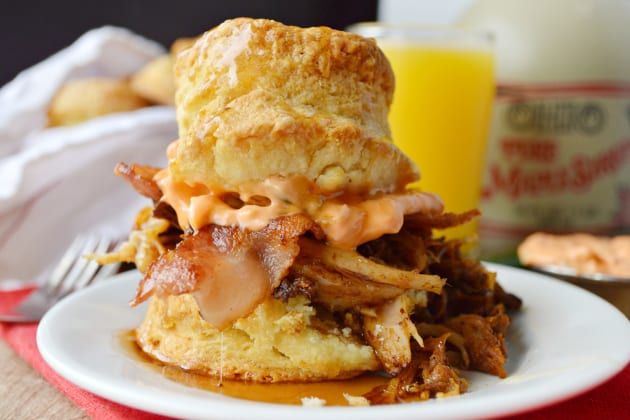 a bacon and cheese biscuit sandwich on a plate