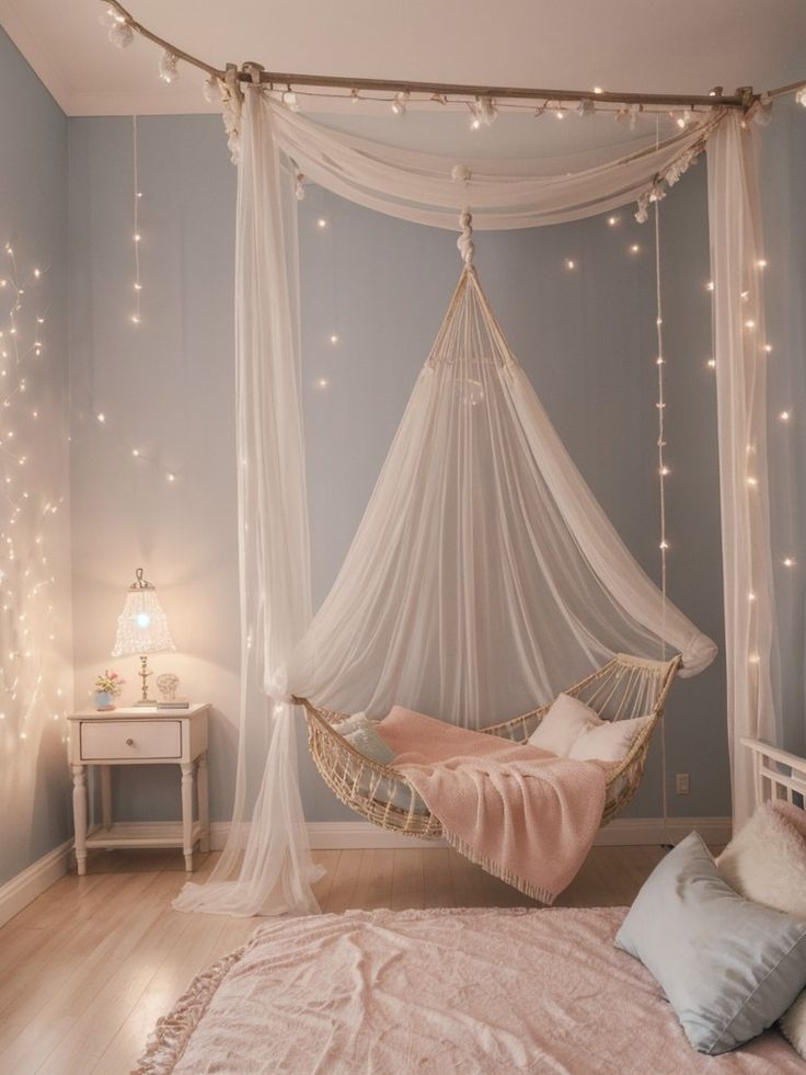 a hammock hanging from the ceiling in a bedroom with string lights on the walls