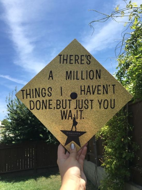 someone holding up a graduation cap that says, there's a million things i haven't done but just you wait