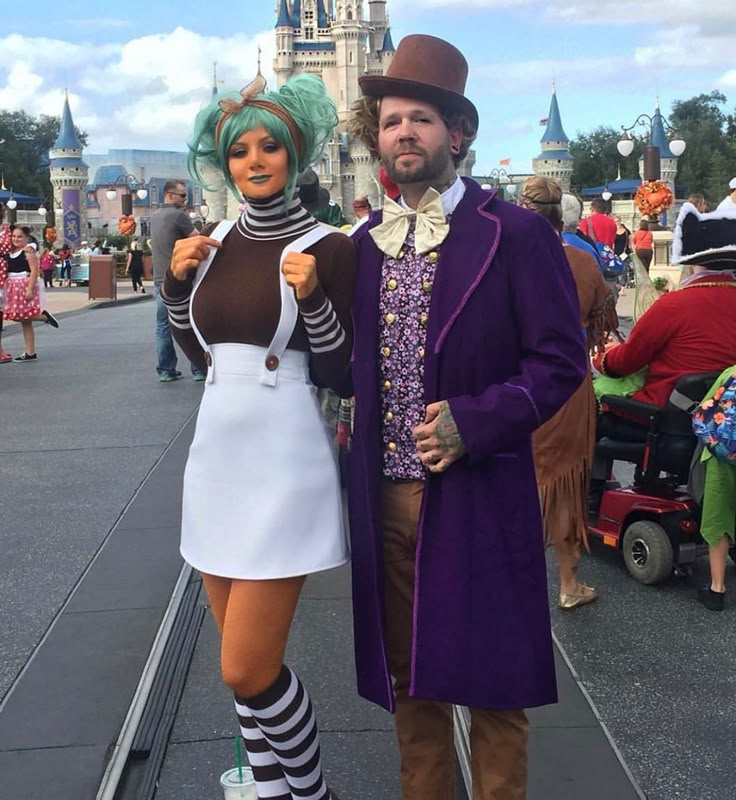 a man and woman dressed up in costumes