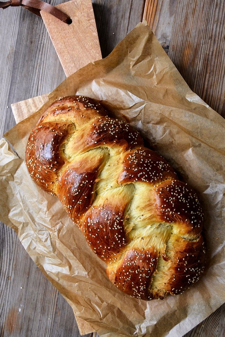 a loaf of bread sitting on top of a piece of wax paper