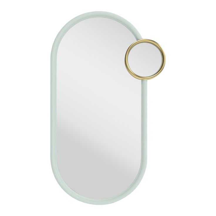 an oval mirror with a gold ring on it