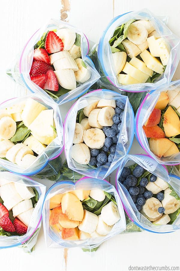 six plastic bags filled with different types of fruit