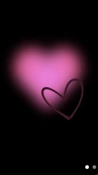 a pink heart on a black background