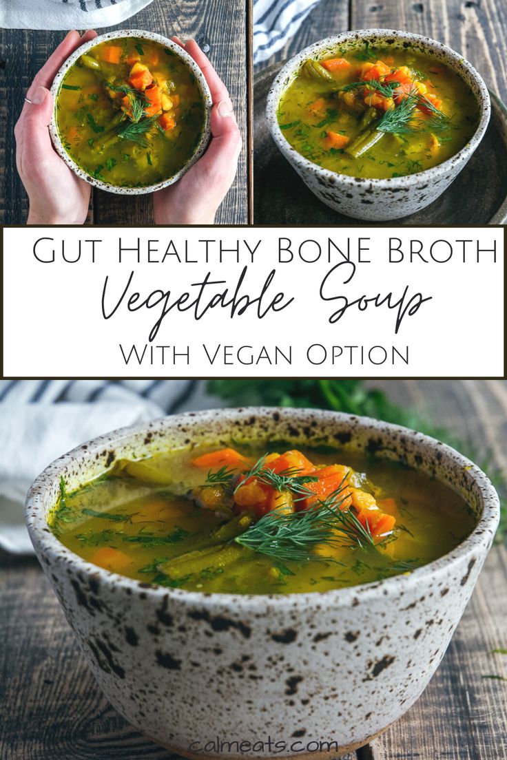 a bowl of vegetable soup with carrots and broth in it, on top of a wooden table