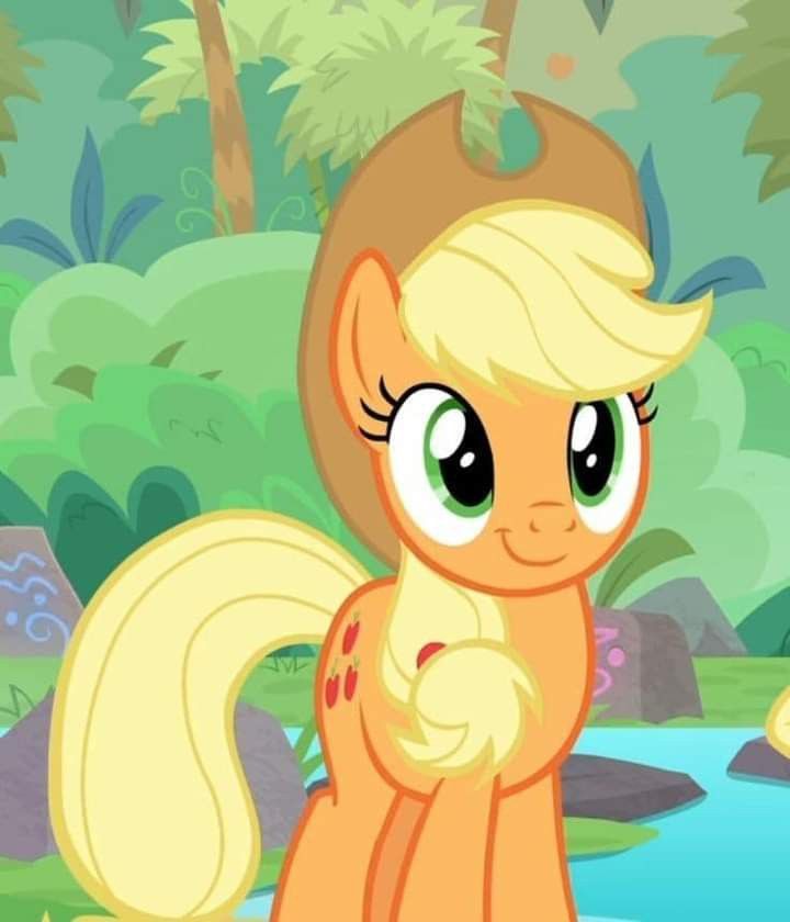 a little pony with big eyes standing in the woods