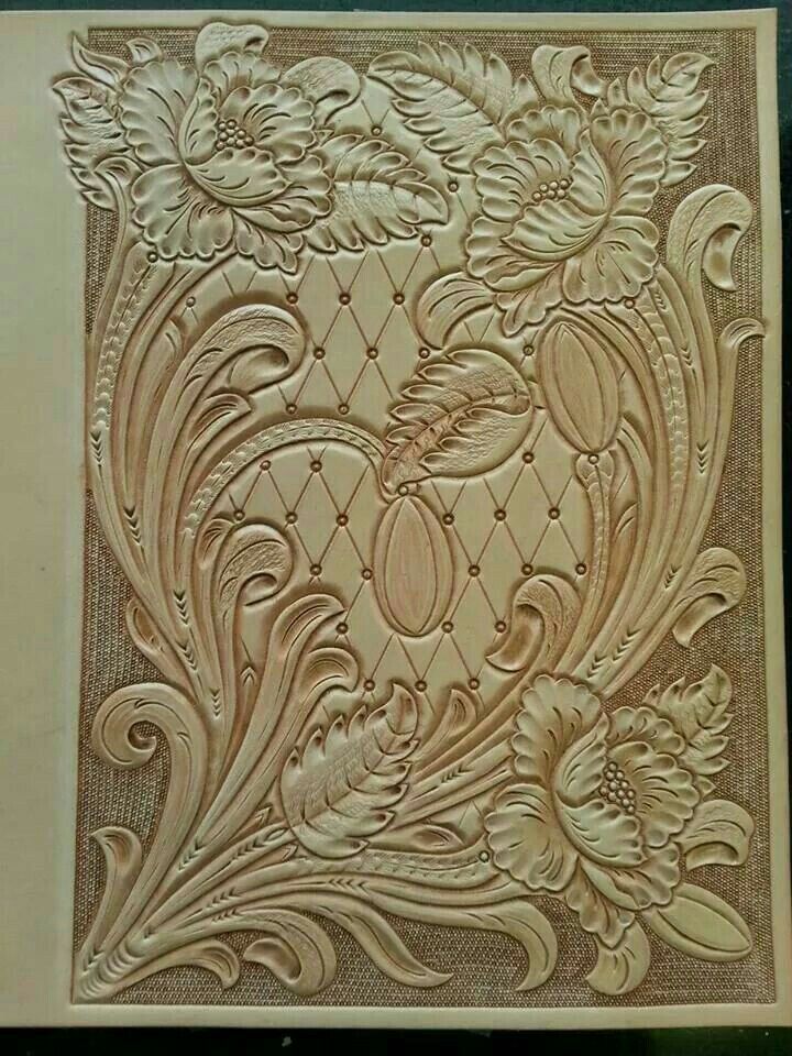 an intricately carved paper with flowers on it