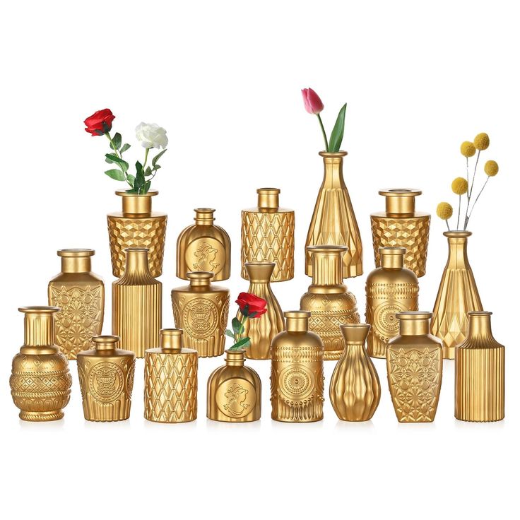 a group of gold vases with flowers in them on a white background for display