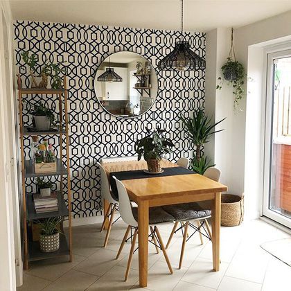 a dining room with a table and chairs next to a sliding glass door