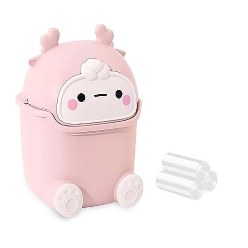 a small pink toy with wheels and ears on it's face, sitting next to two smaller plastic objects