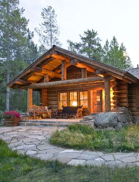 a log cabin is lit up at night