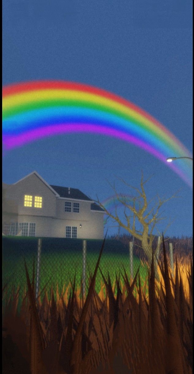 a rainbow appears in the sky over a house and cornfield with a bird flying by